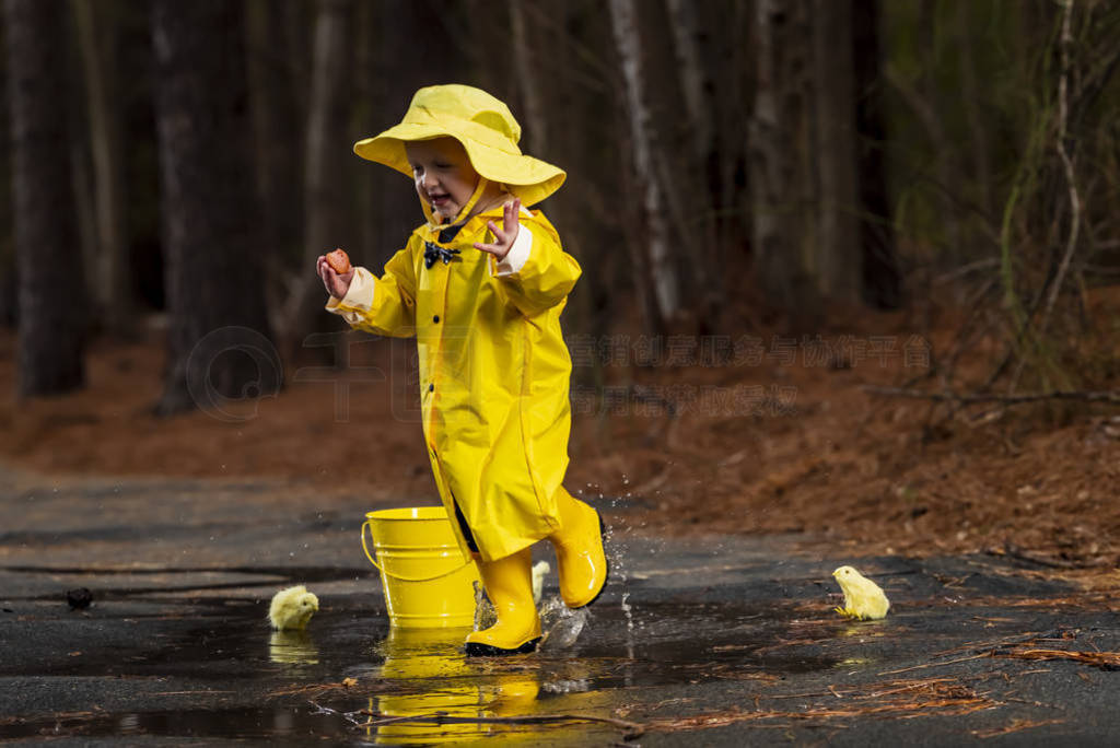 Child Enjoying The Rain In His Galoshes