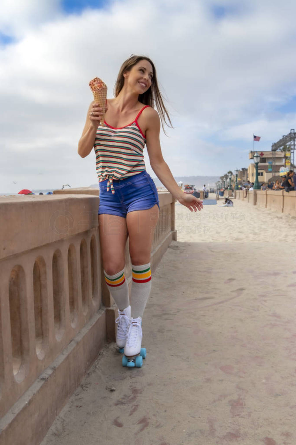 Lovely Brunette Female Model Eats Ice Cream And Rollerskates At