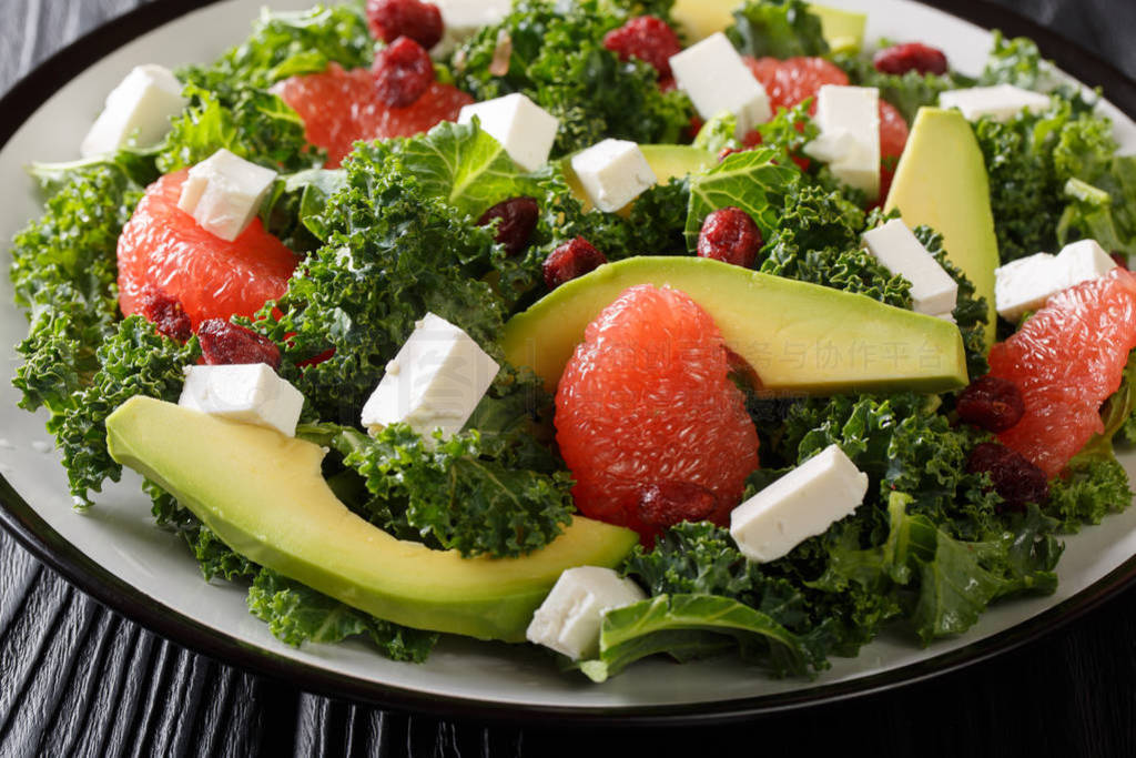 Balanced salad of leaf cabbage, avocado, grapefruit, cheese and