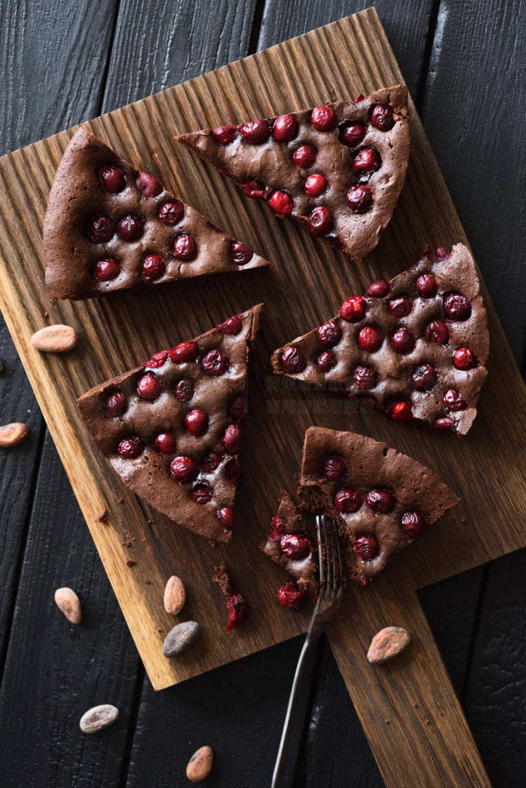 Yummy chocolate dessert. Homemade brownies with cherries on oak