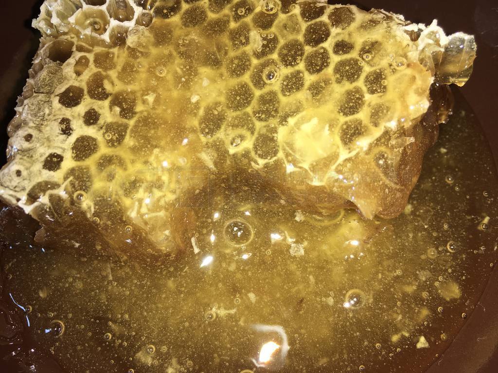 abstract hexagonal background natural fresh golden liquid honey
