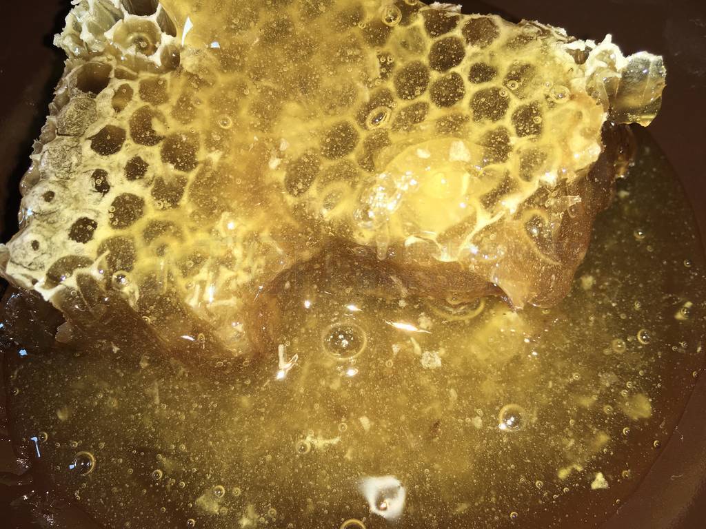 abstract hexagonal background natural fresh golden liquid honey