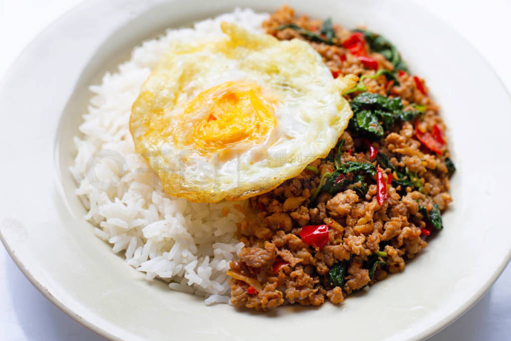 Rice topped with stir-fried pork with basil and fried egg