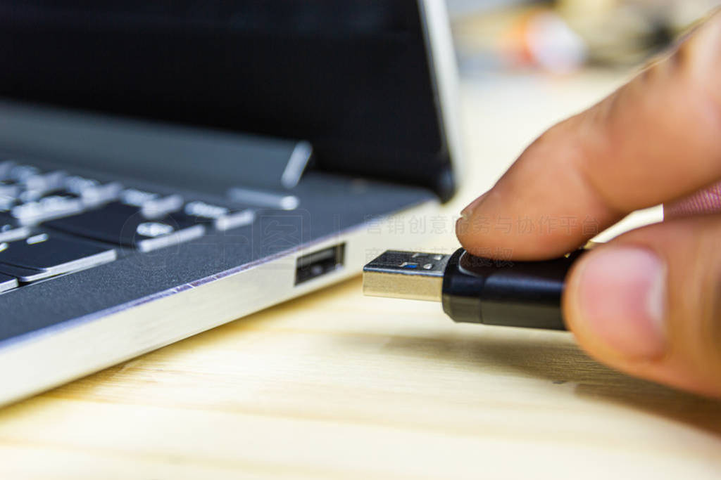 hand man hold Flash drive connect to USB port