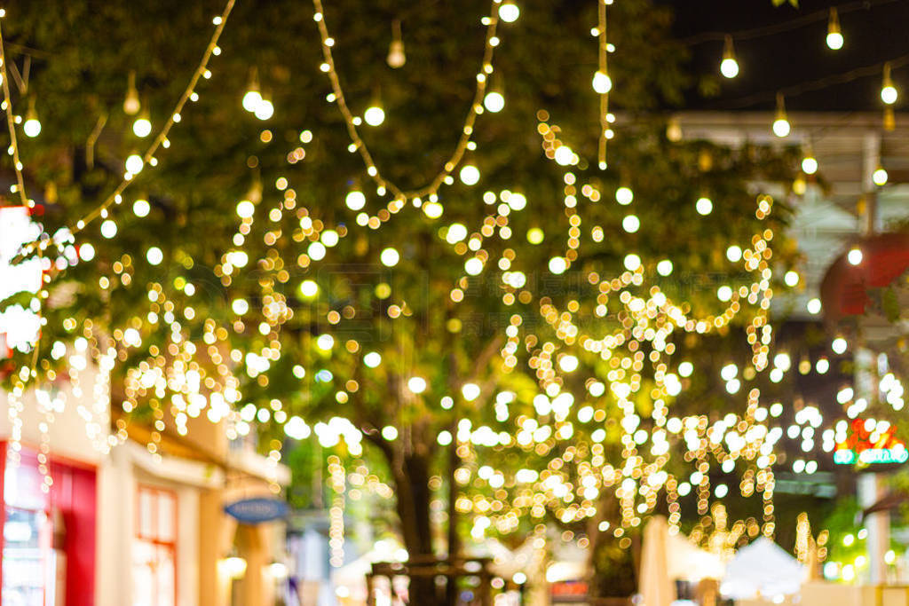 Blur - bokeh Decorative outdoor string lights hanging on tree
