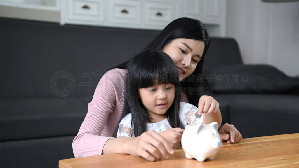 Financial concepts. The mother is teaching her daughter to know