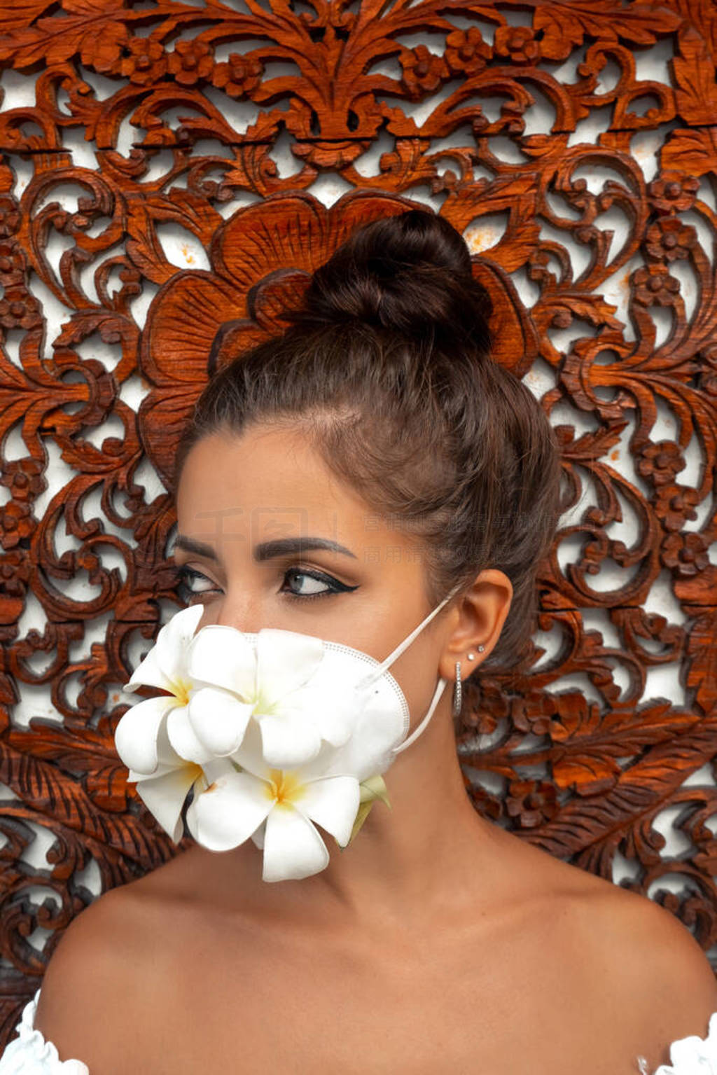 Girl in an antiviral mask on an unusual background. Fashion pho