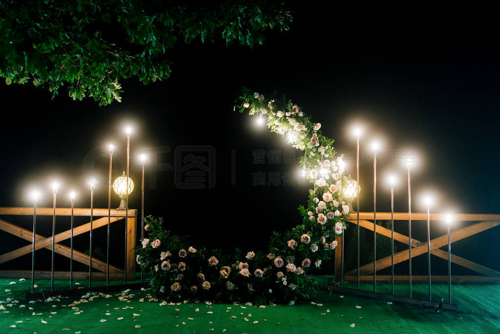 Night wedding ceremony with a lot of lights, candles, lanterns.