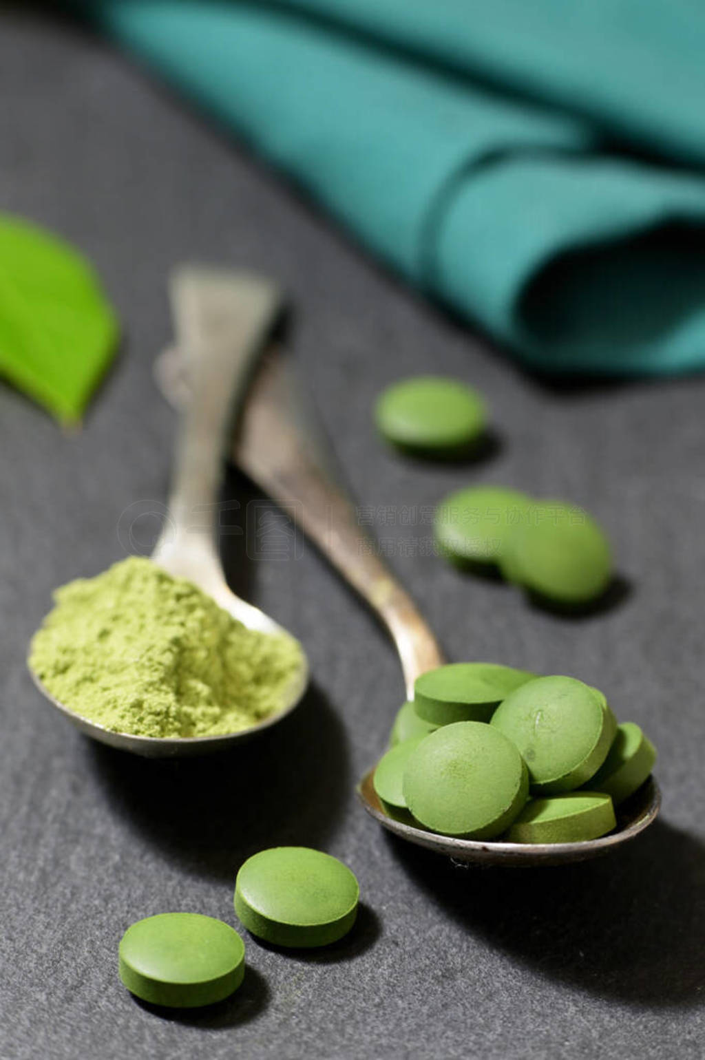 Chlorella And Barley Powder On Spoons on ardesia