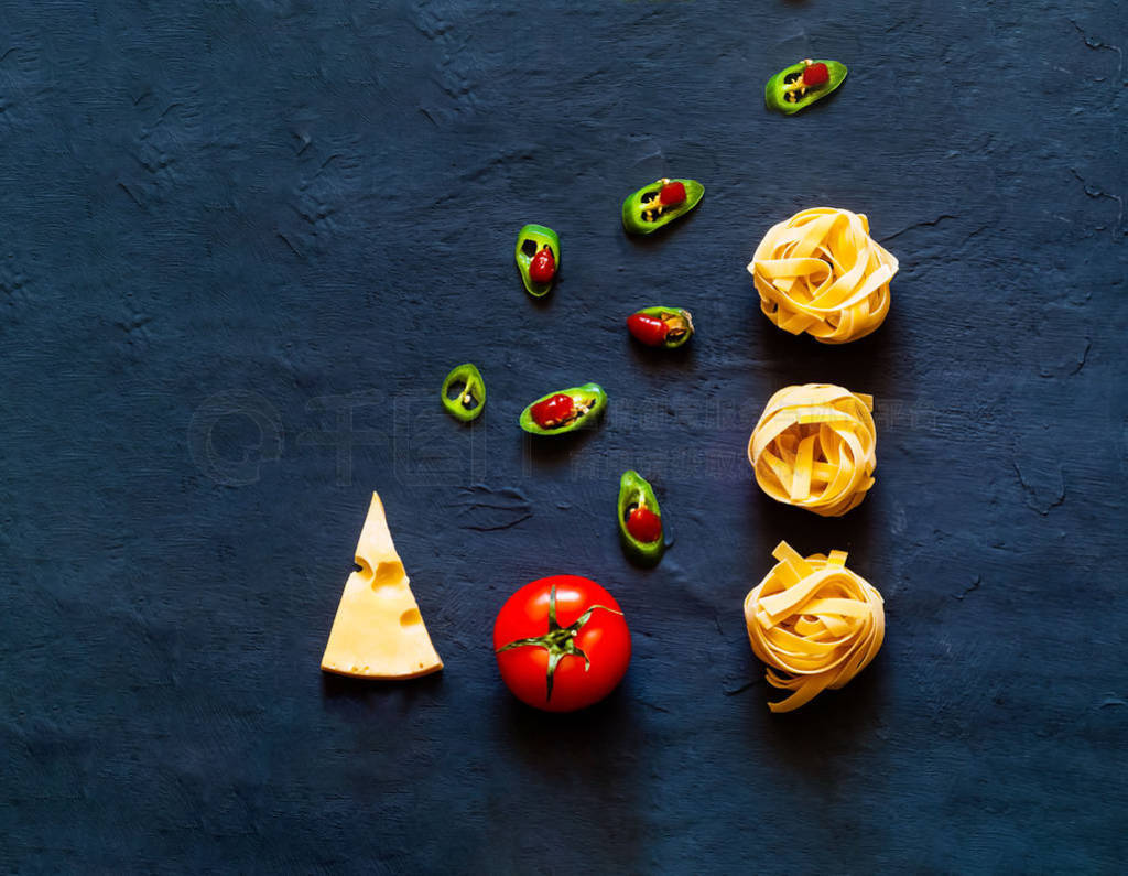 Food Background of Italian Pasta. Pasta fettucine on blue backgr