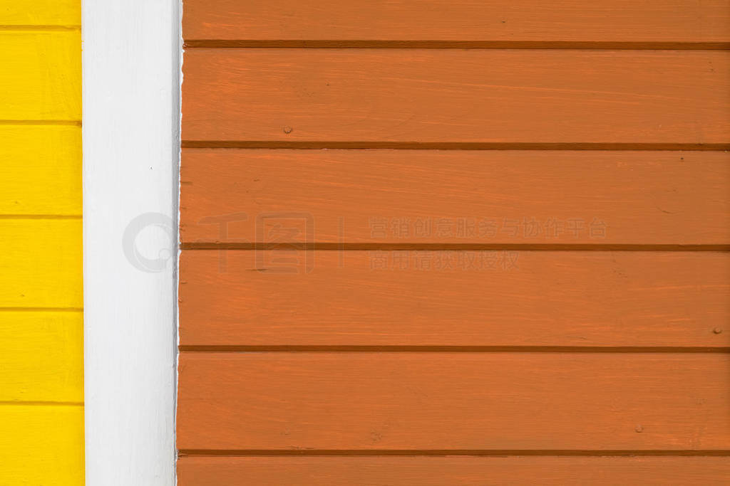 Wooden background of painted brown and yellow boards.