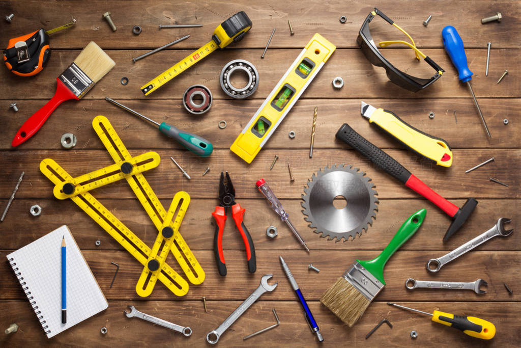 set of tools and instruments at wooden table