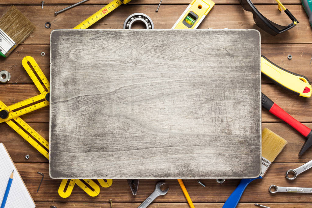 set of tools and instruments at wooden table