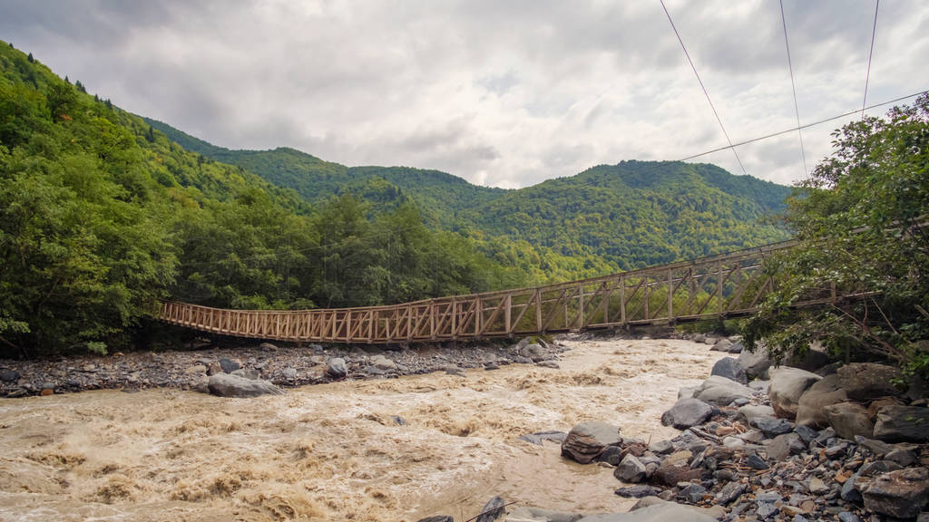 Hanged rope bridge over the river