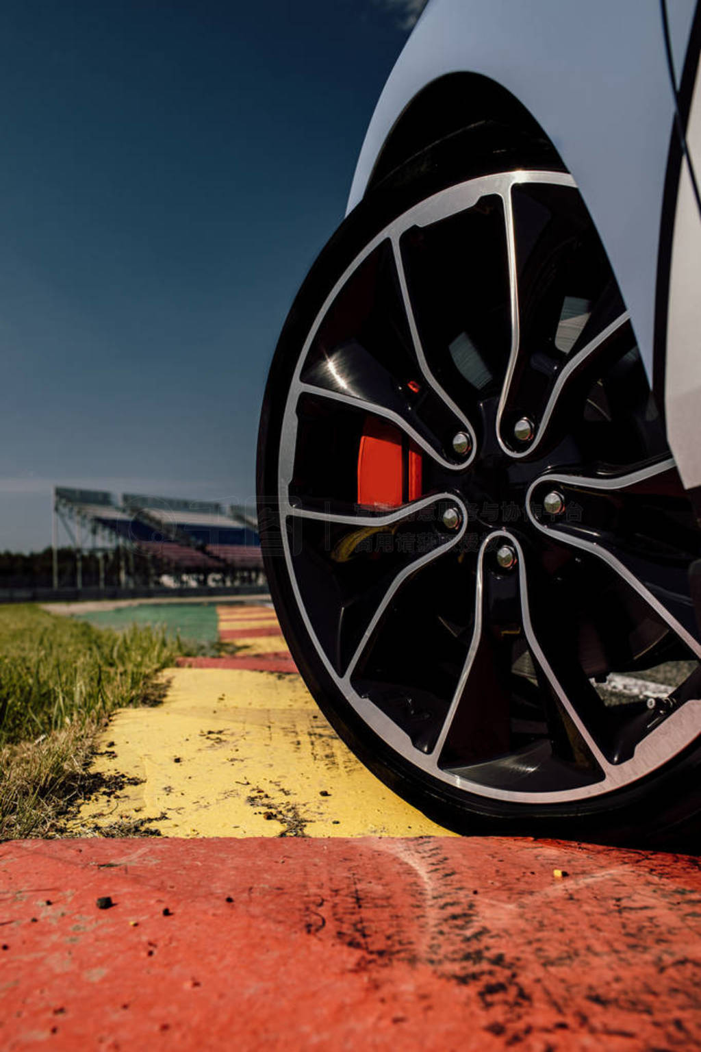 The beautiful wheel of a sport car, with the asphalt, in a race