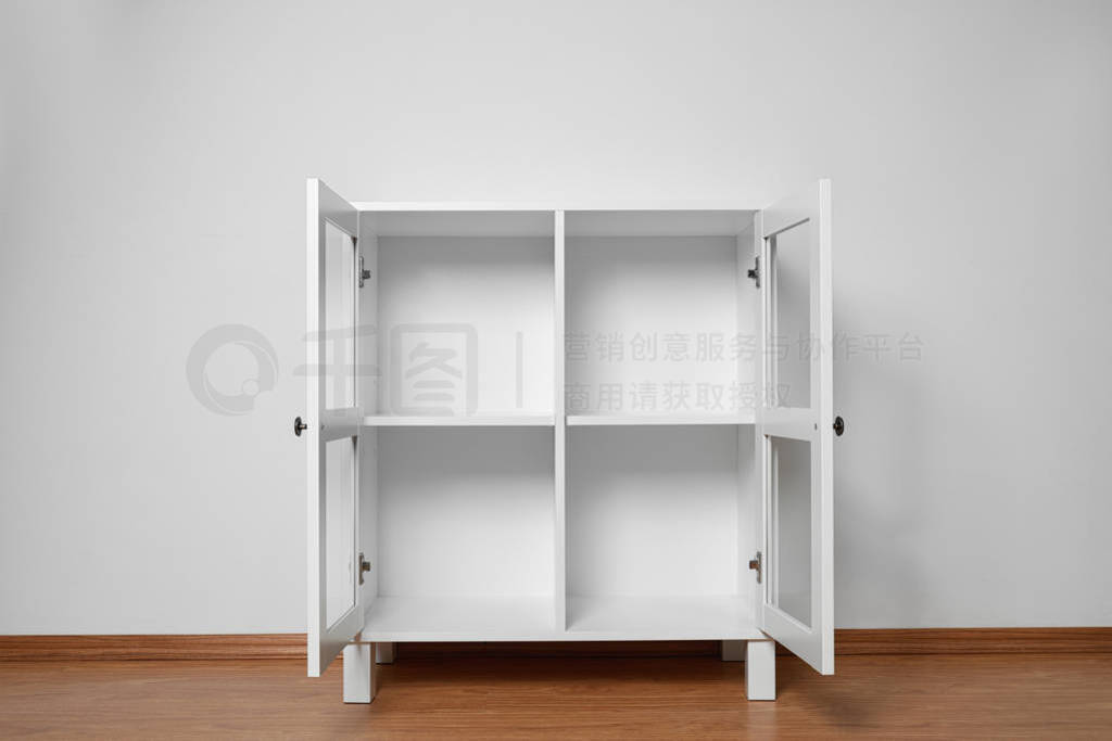 Empty wooden cabinet near white wall. Stylish home furniture
