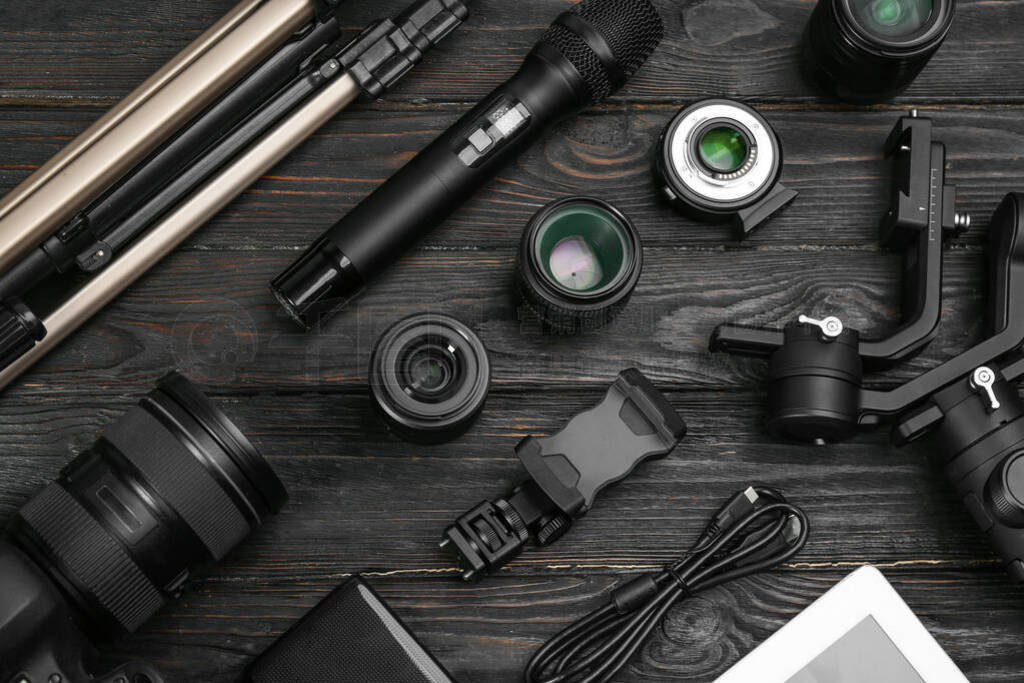 Flat lay composition with camera and video production equipment