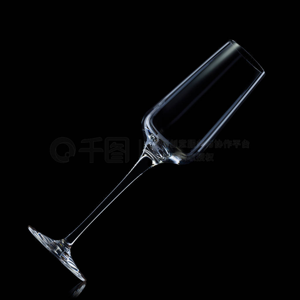 Empty luxury champagne glass isolated on a black background