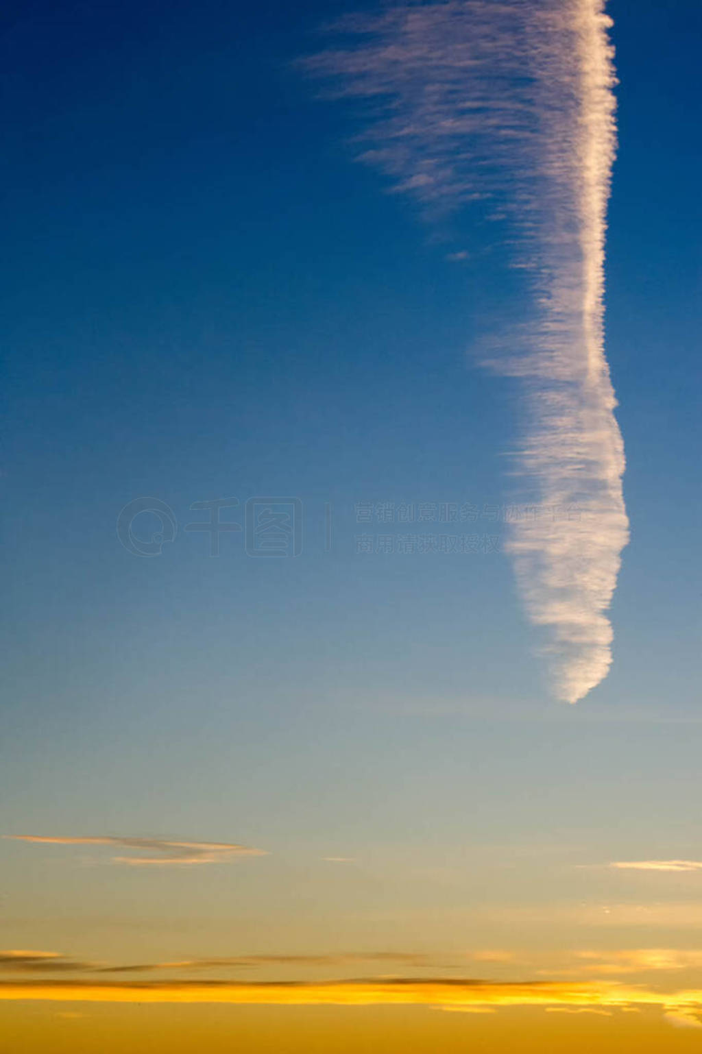 clouds in the blue sky. a visible mass of condensed water vapor