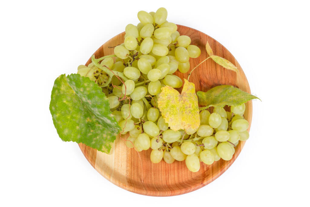 Top view sultana grape with vine leaves on wooden dish