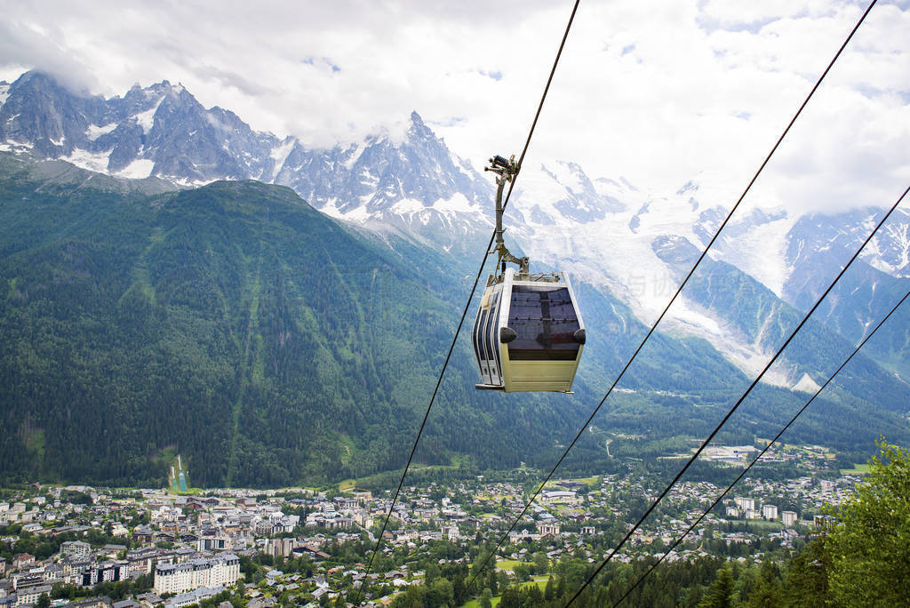 Cable car travelling over Chamonix in Mont Blanc area in France
