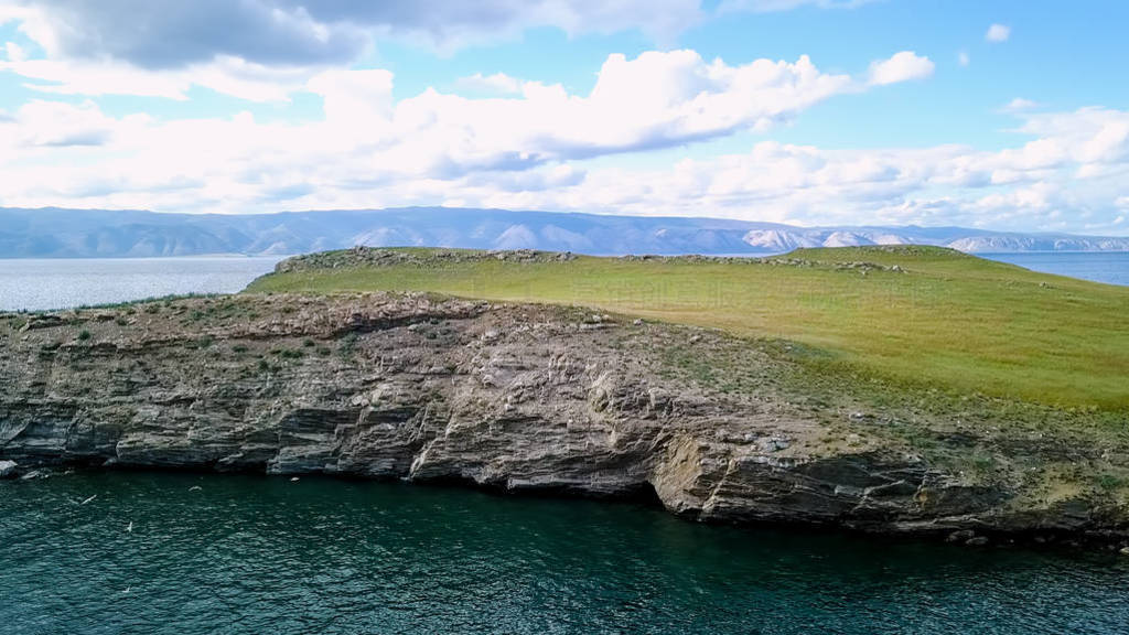 Flight over land and water. Russia, Baikal, Bay Small Sea. Islan