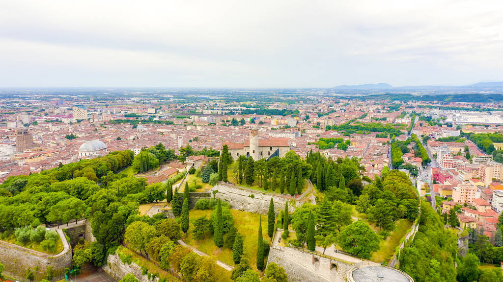 Brescia, Italy. Castello di Brescia. Flight over the city in clo