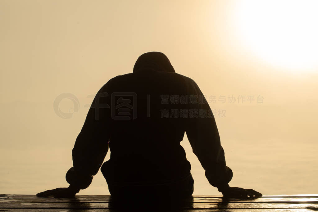 The silhouette of stressed and depressed man of working under