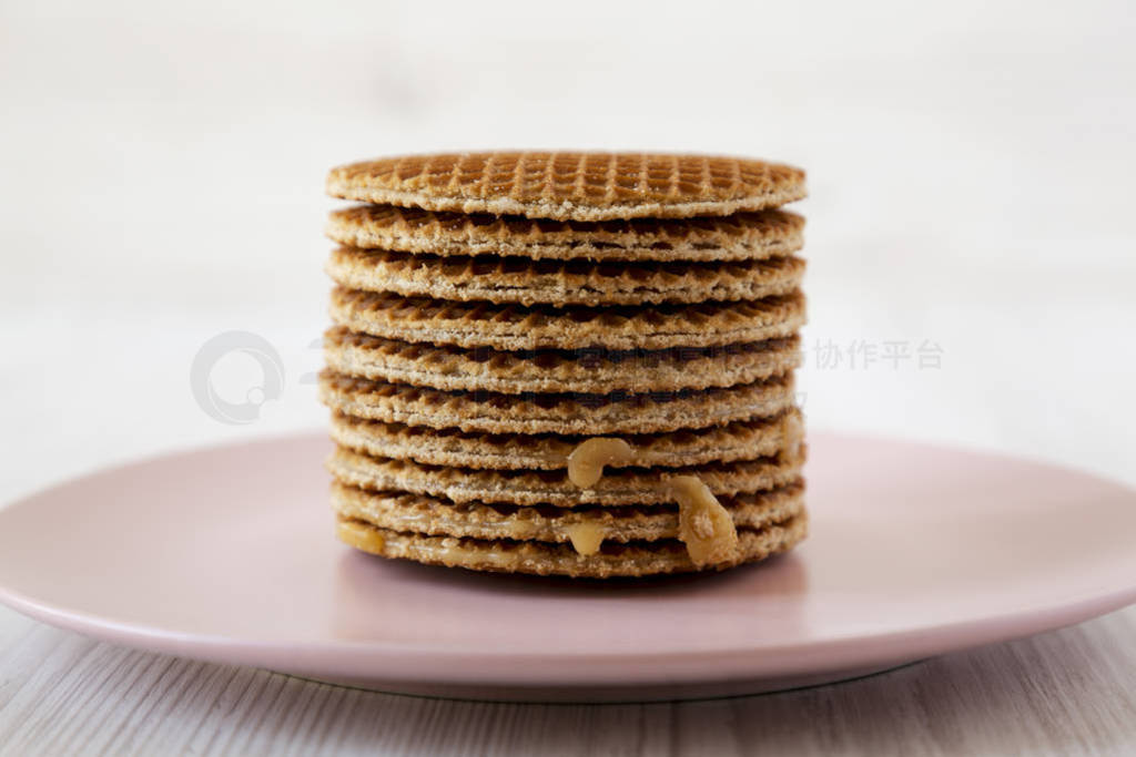 Stack of homemade Dutch stroopwafels with honey-caramel filling