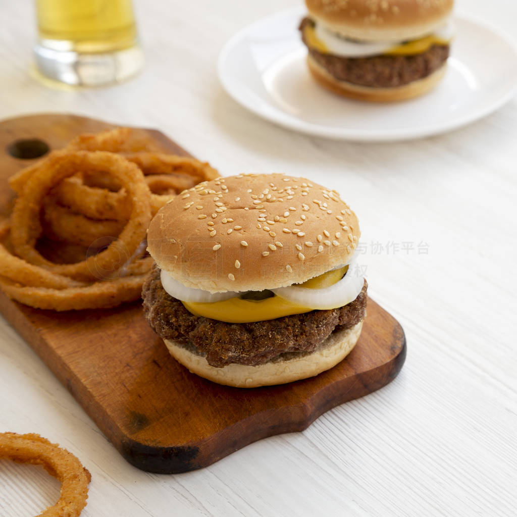 Homemade Mississippi Slug Burgers with onion rings and glass of