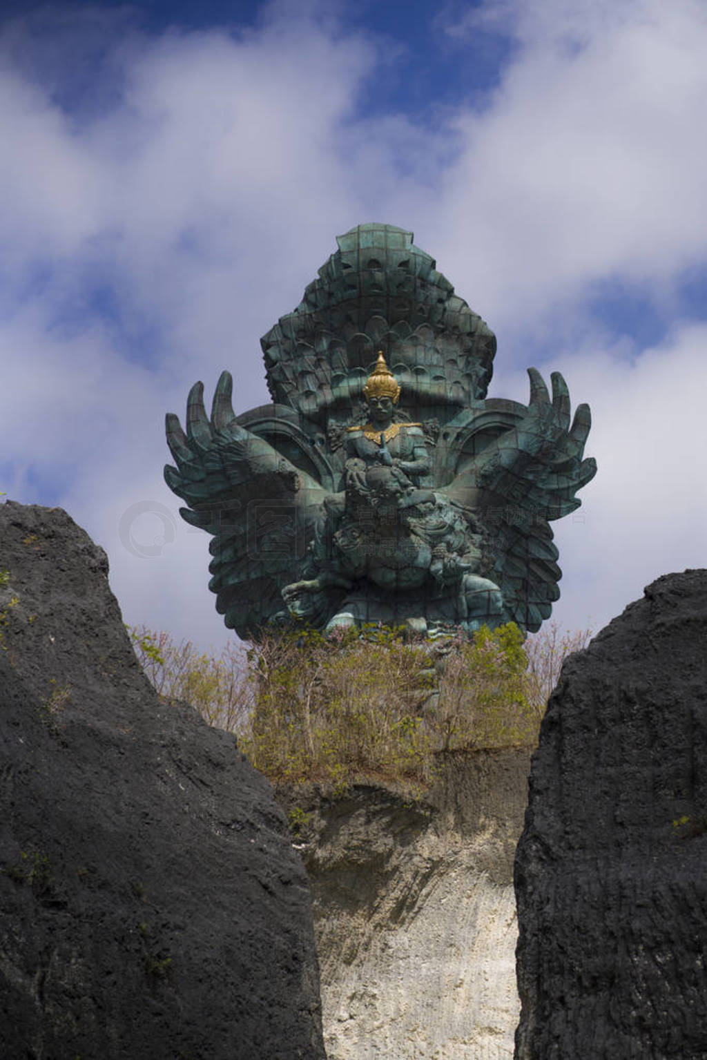 impressive view of Garuda Wisnu green copper statue inspired in