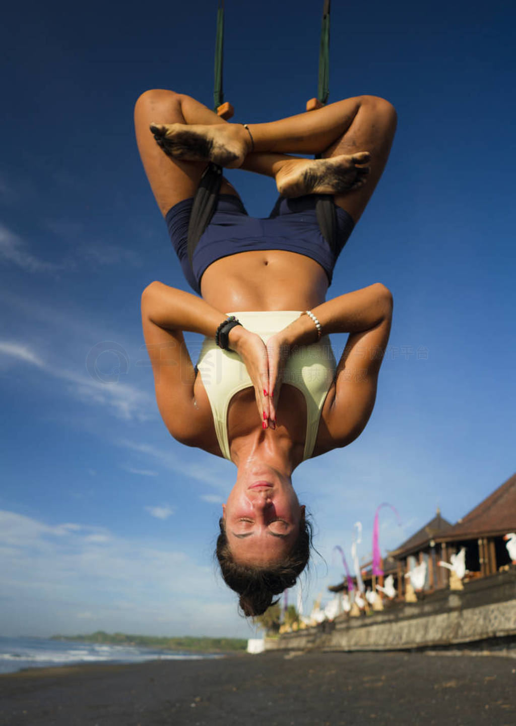 aerial yoga meditation beach workout - young attractive and heal