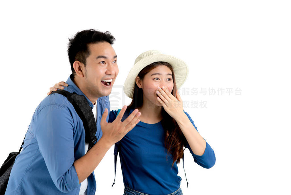 Happy Asian couple with big surprisce and looking up something,