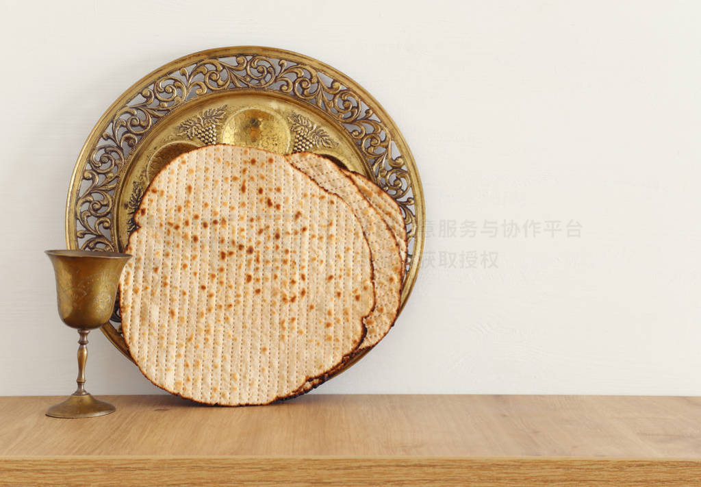 Pesah celebration concept (jewish Passover holiday) over wooden
