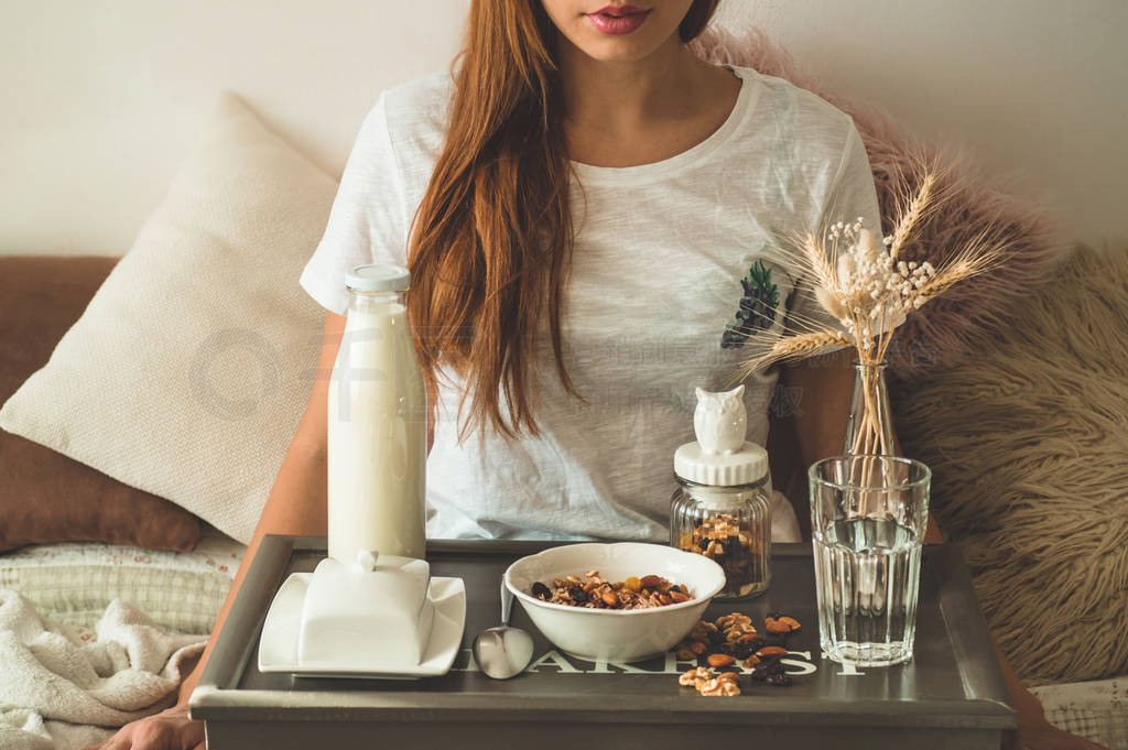 Healthy organic nutrition. Woman enjoying breakfast with oatmeal