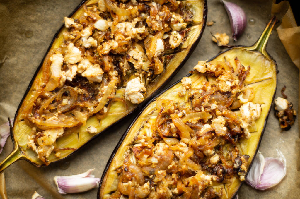 Baked eggplant stuffed with onions, garlic, olive oil, feta.