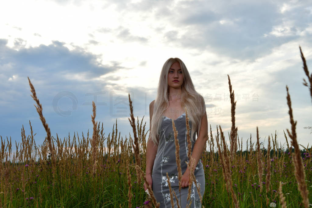 Closeup picture of perfect blonde pensive lady relaxing on heap