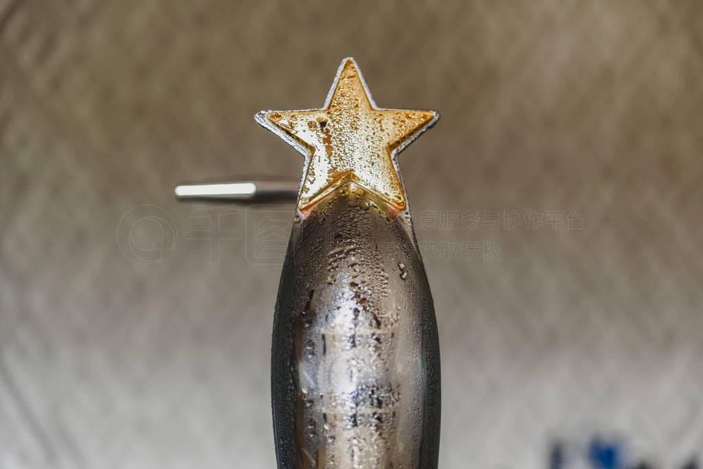 Ice cold beer dispenser in a bar, with flat background for copy