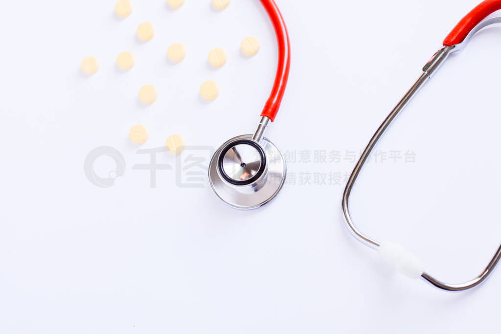 stethoscope for doctor checkup with pills on medical laboratory