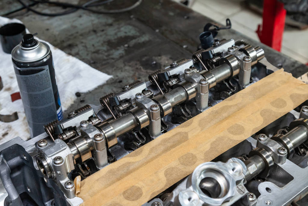 A four-cylinder engine with new camshaft dissembled and removed