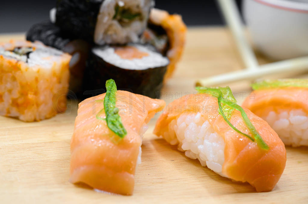 Japanese restaurant food. assorted sushi rolls on black isolated