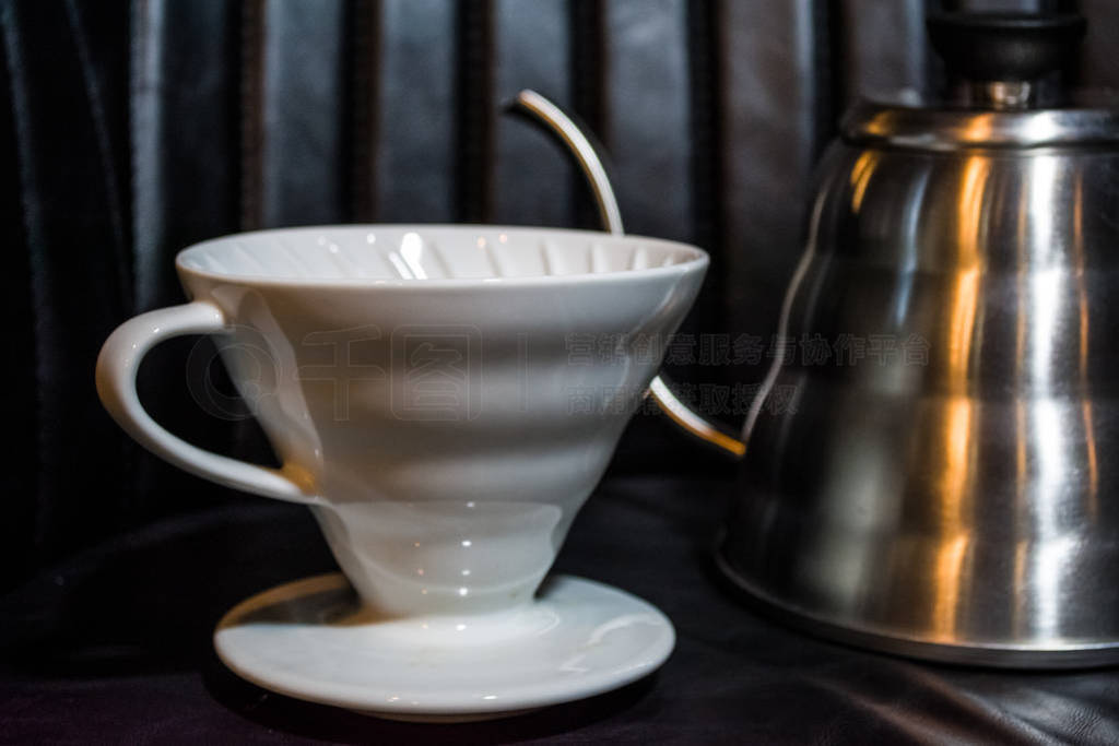 White funnel Pourover on a black background for preparation of c