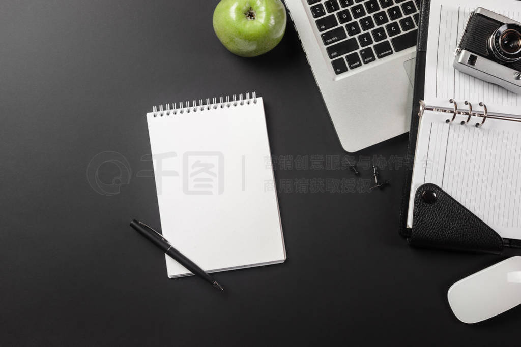 Elegant black office desktop with laptop and cup of coffee. Top
