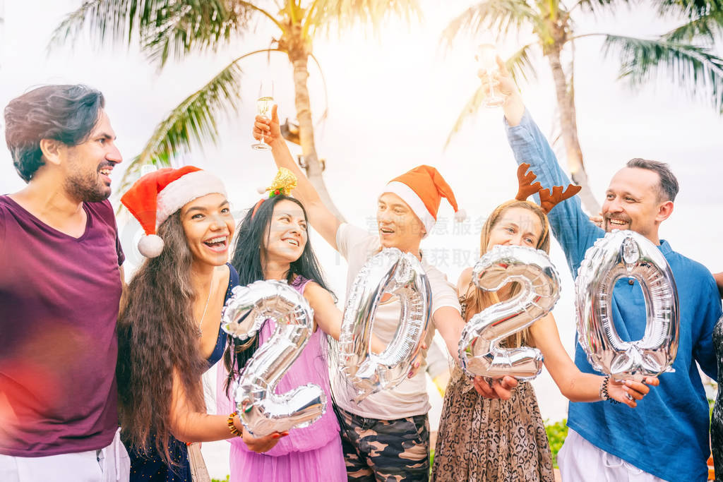 Group of happy people of mixed race friends celebrate Christmas