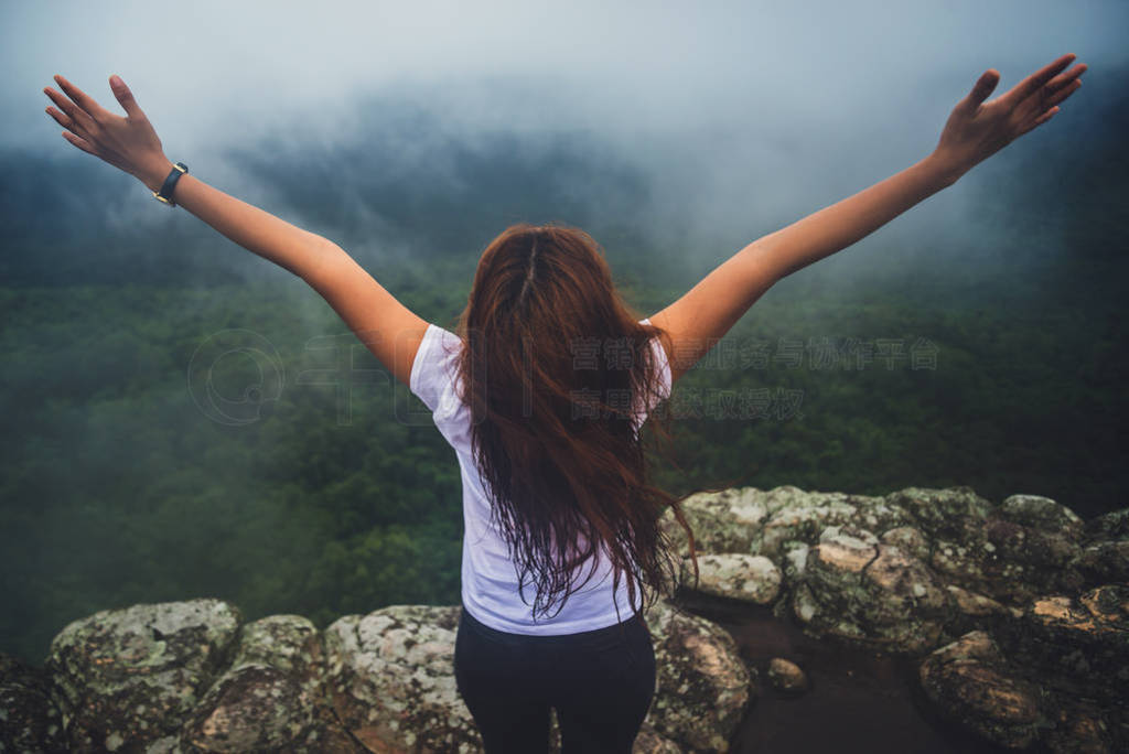 Asian women travel. Morning atmosphere nature Forests. walk in t