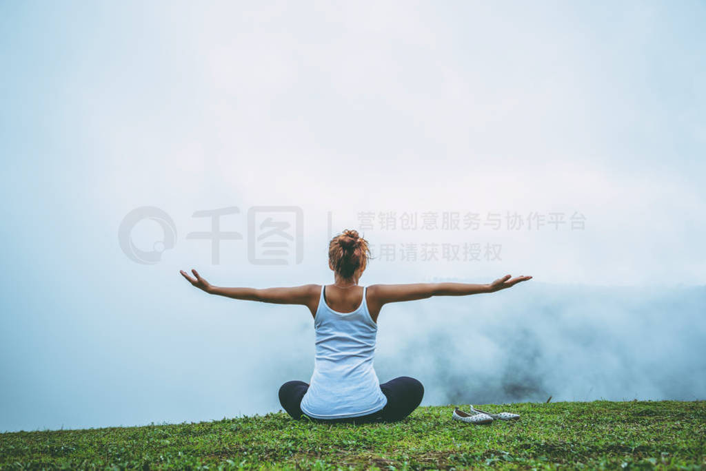 Asian women relax in the holiday. Play if yoga, natural forests,