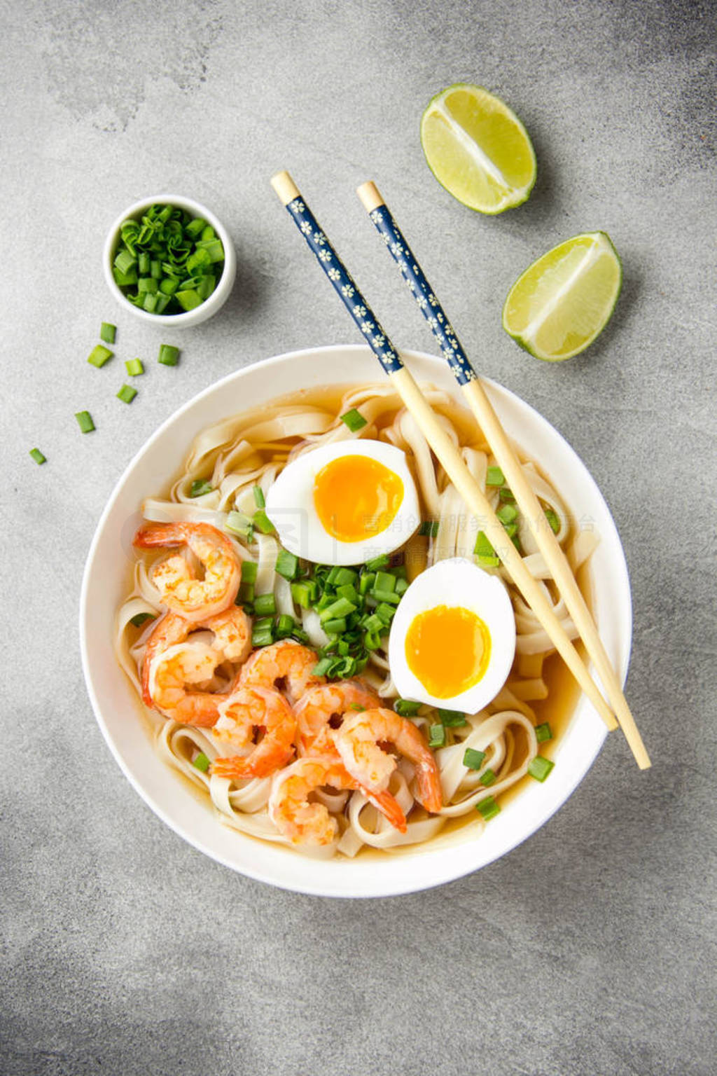 Japanese soup with wheat noodles, fried shrimp, soft-boiled egg