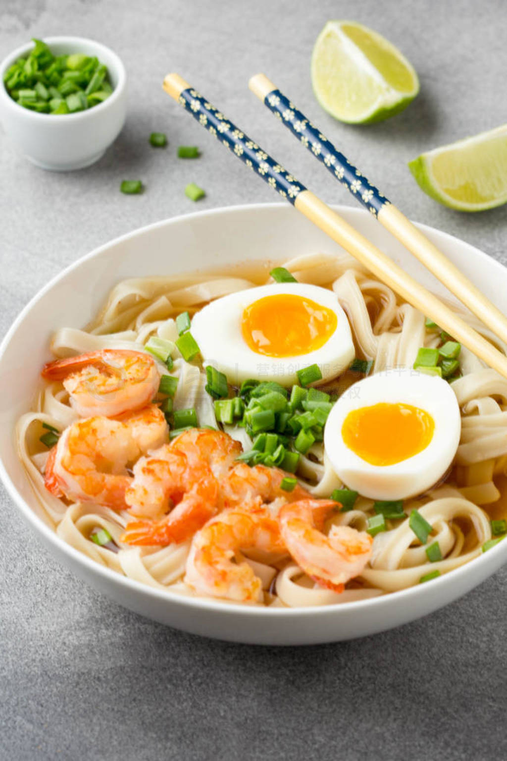 Japanese soup with wheat noodles, fried shrimp, soft-boiled egg