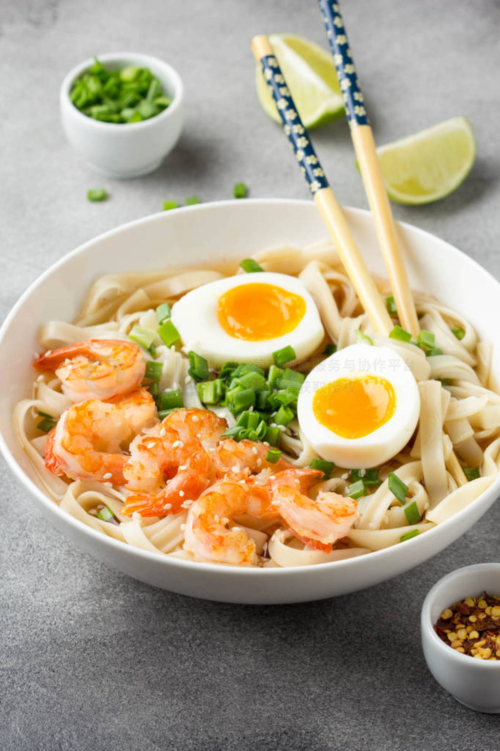 Japanese soup with wheat noodles, fried shrimp, soft-boiled egg