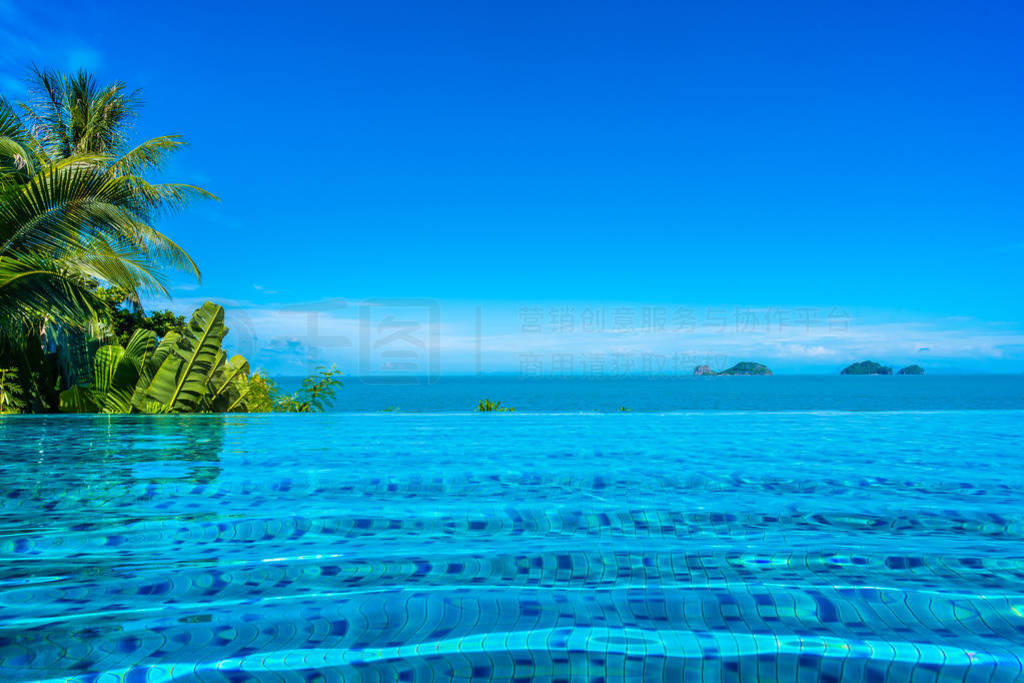 Beautiful luxury outdoor swimming pool in hotel resort with sea